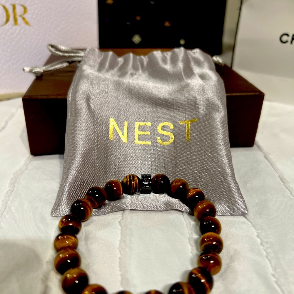 Nest bracelet EUC - semi precious brown stone with gold tag.